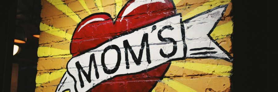 Graffiti with MOM'S painted inside a red heart