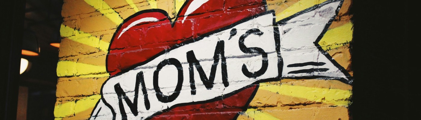 Graffiti with MOM'S painted inside a red heart